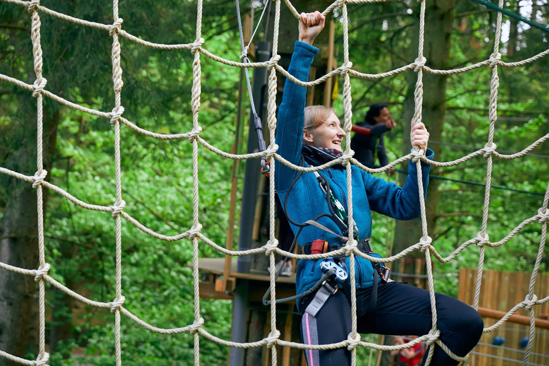 Person climbing a cargo net.