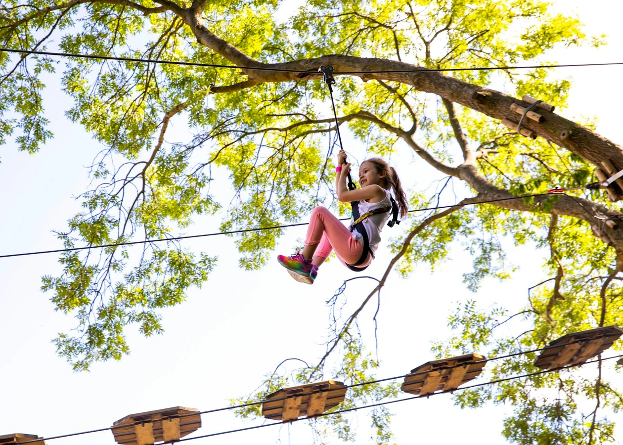 Young person on a zipline.
