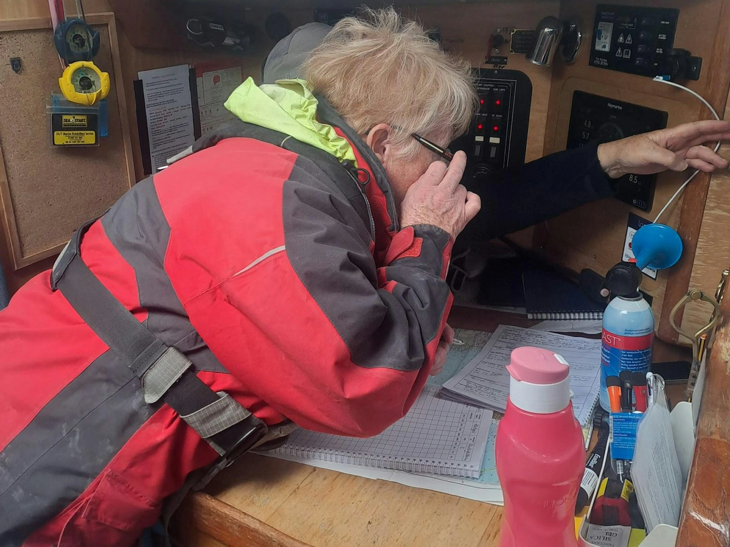 Person using a boat radio.